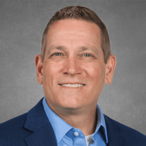 Portrait of Tim Shoop in a business suit